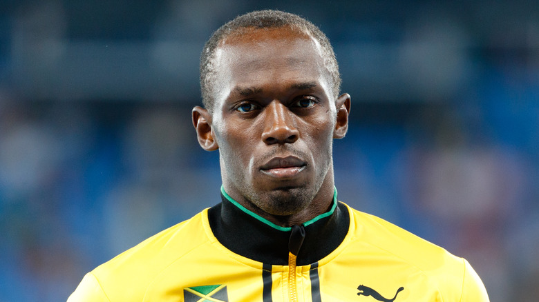 Usain Bolt in yellow tracksuit at the Olympics