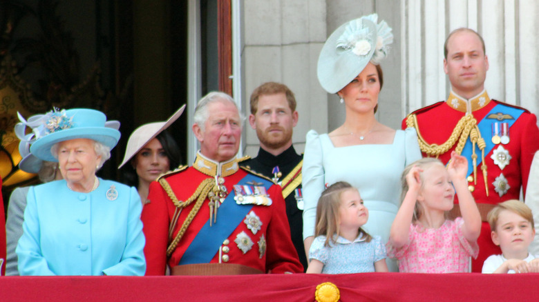 Queen Elizabeth II, Meghan Markle, Prince Charles, Prince Harry with Kate Middleton and Prince William and their three children at a public event 