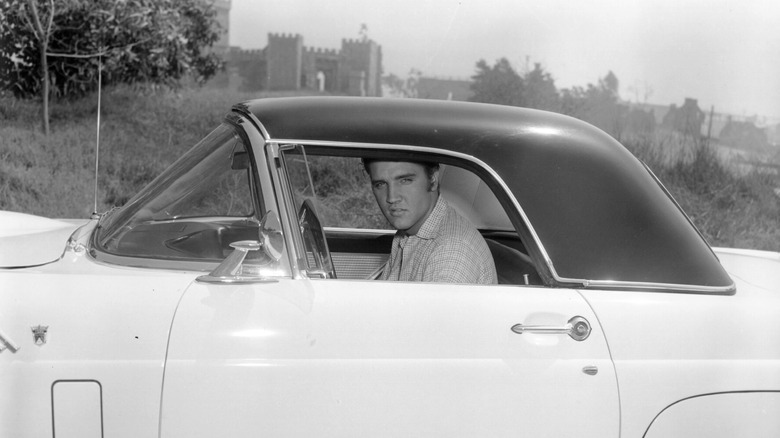 Elvis Presley sat in car