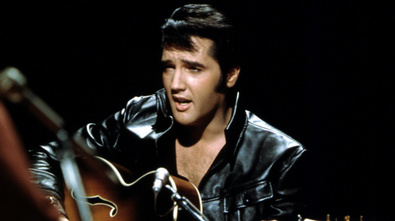 Elvis Presley on stage leather