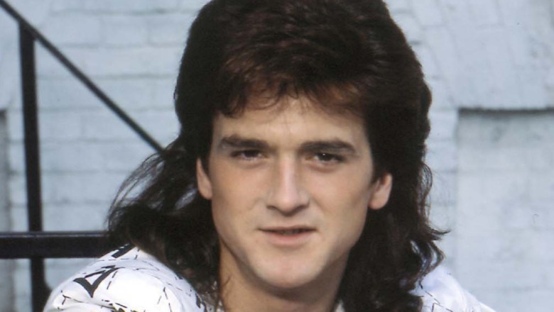 Les McKeown smiles on stage