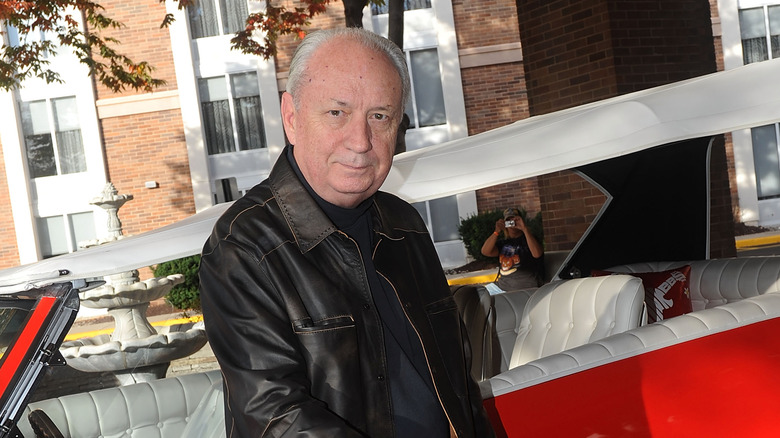 Michael Nesmith poses The Monkees car