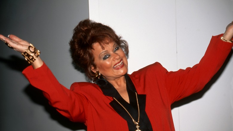 Tammy Faye Bakker waving her arms