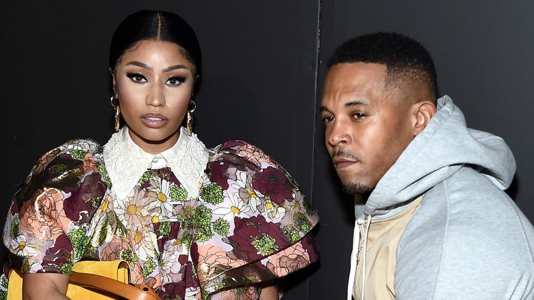 Nicki Minaj and husband Kenneth Petty seated