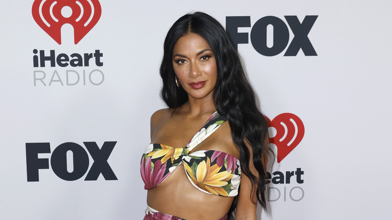 Nicole Scherzinger poses in a floral two piece outfit