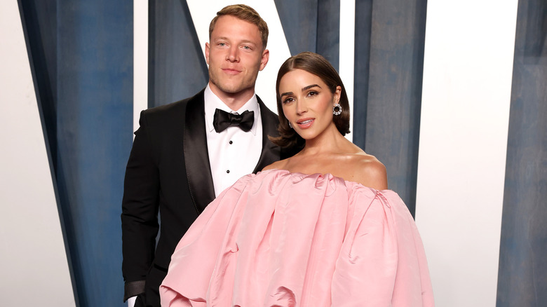 Olivia Culpo and Christian McCaffrey at an event 