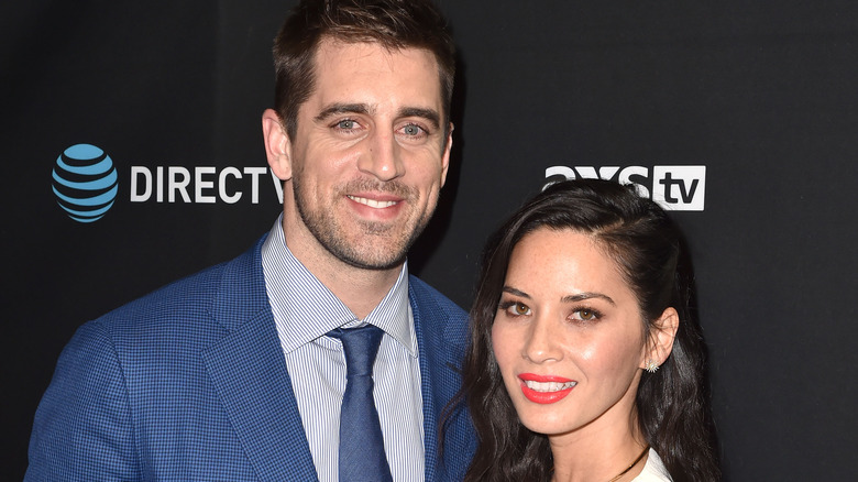 Aaron Rodgers Olivia Munn smile red carpet