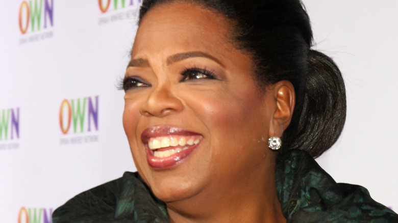 Oprah Winfrey smiling on the red carpet