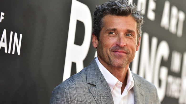 Patrick Dempsey smiling and looking to the side