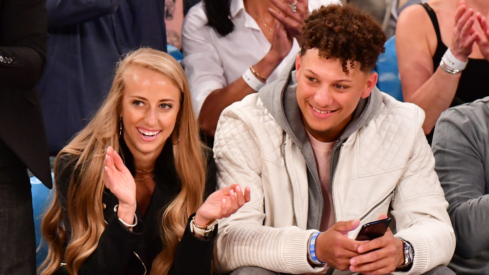 Brittany Matthews and Patrick Homes at a basketball game