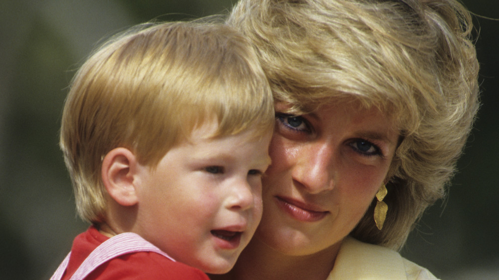 Princess Diana holding a baby Prince Harry