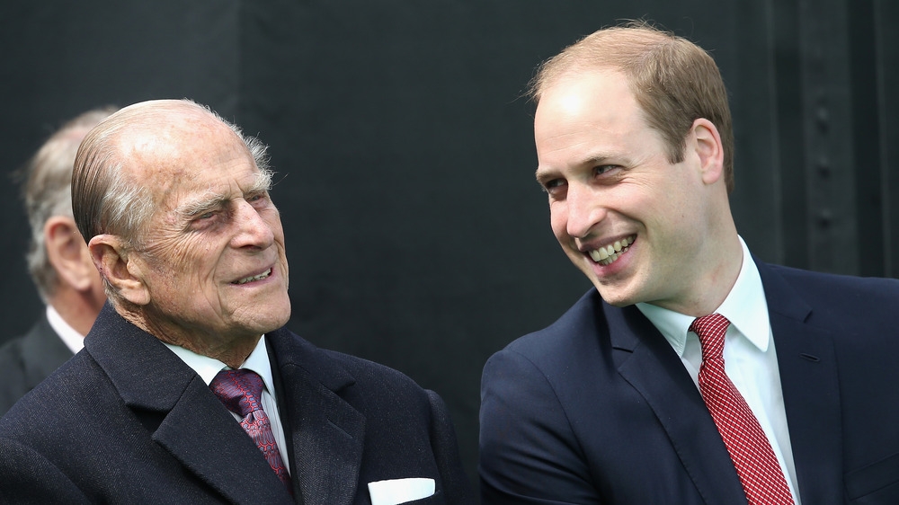 Prince Philip and Prince William laugh