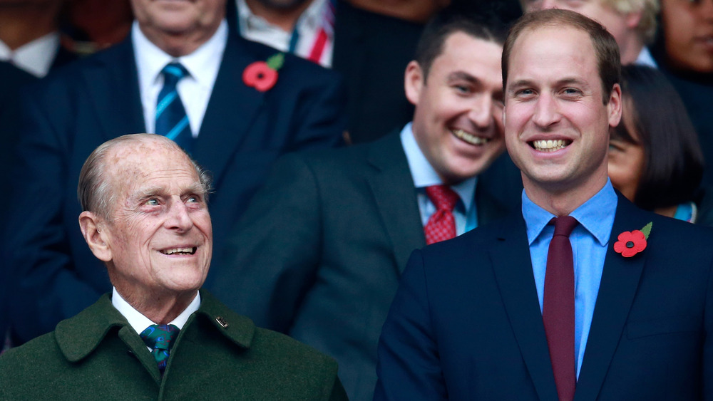 Prince William and Prince Philip smiling 