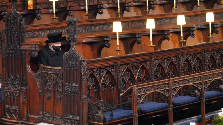 Queen Elizabeth II sitting alone at Prince Philip's funeral