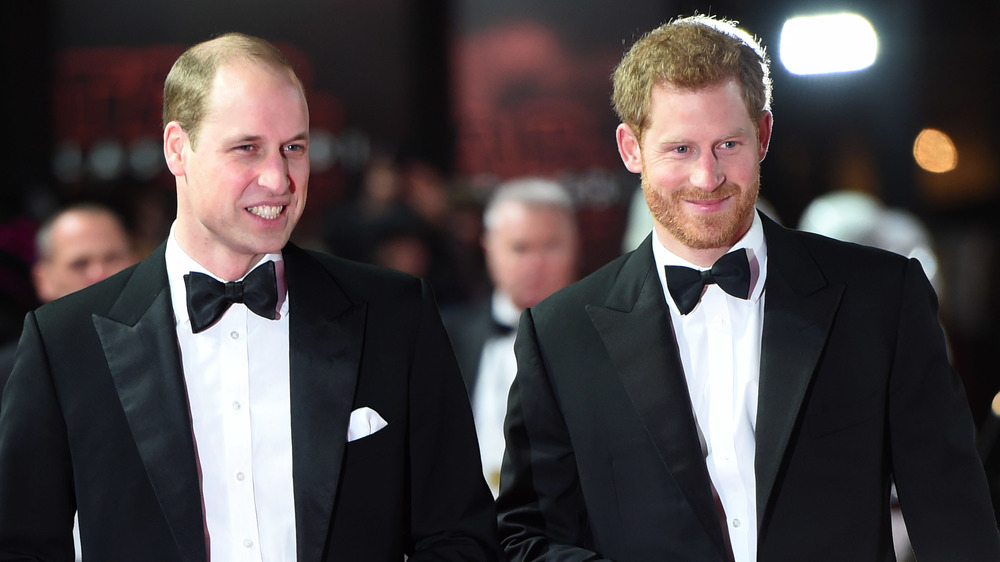 Prince William and Prince Harry wearing tuxedos at an event