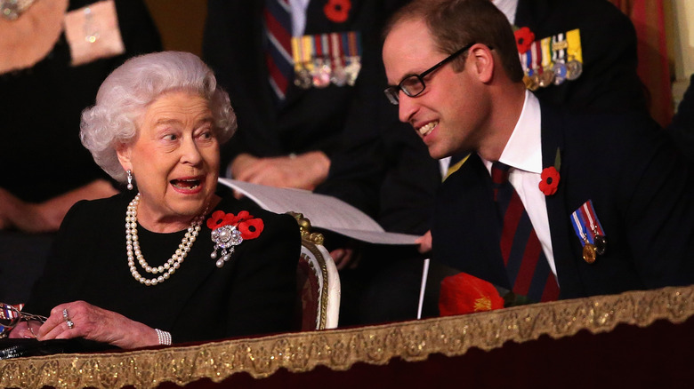 Queen Elizabeth and Prince William smiling and laughing together