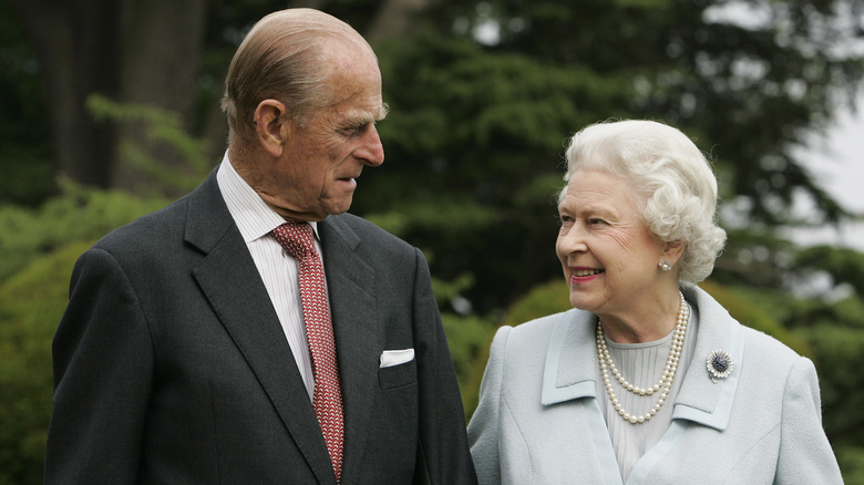 Prince Philip and Queen Elizabeth II smiling at each other