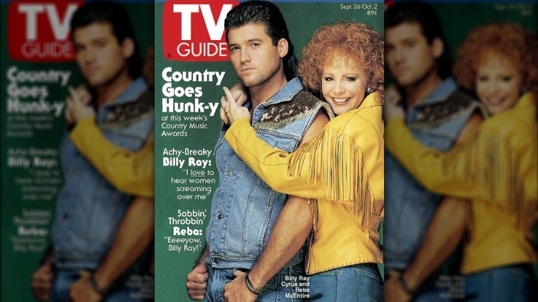 Reba McEntire hugging Billy Ray Cyrus