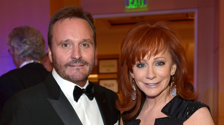 Narvel Blackstock and Reba McEntire posing