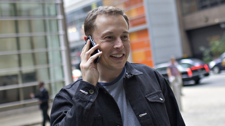 Elon Musk talking on a phone