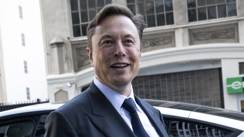 Elon Musk wearing a suit