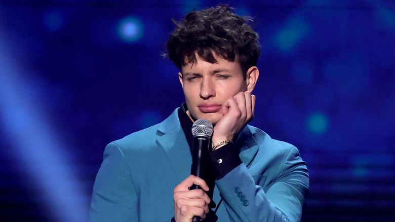 Matt Rife holding microphone