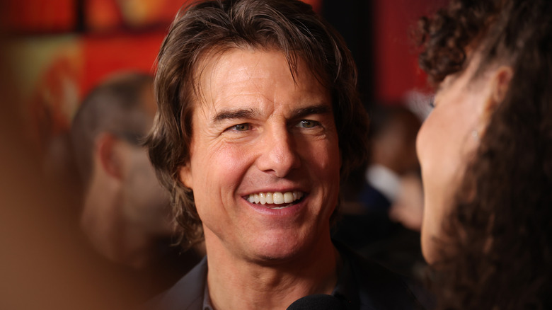 Tom Cruise smiling at film premiere