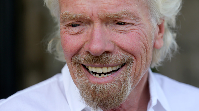 Richard Branson smiling and looking to the side