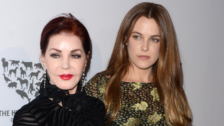 Riley Keough and Priscilla Presley smiling