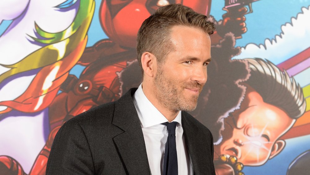 Ryan Reynolds with a sly smile 