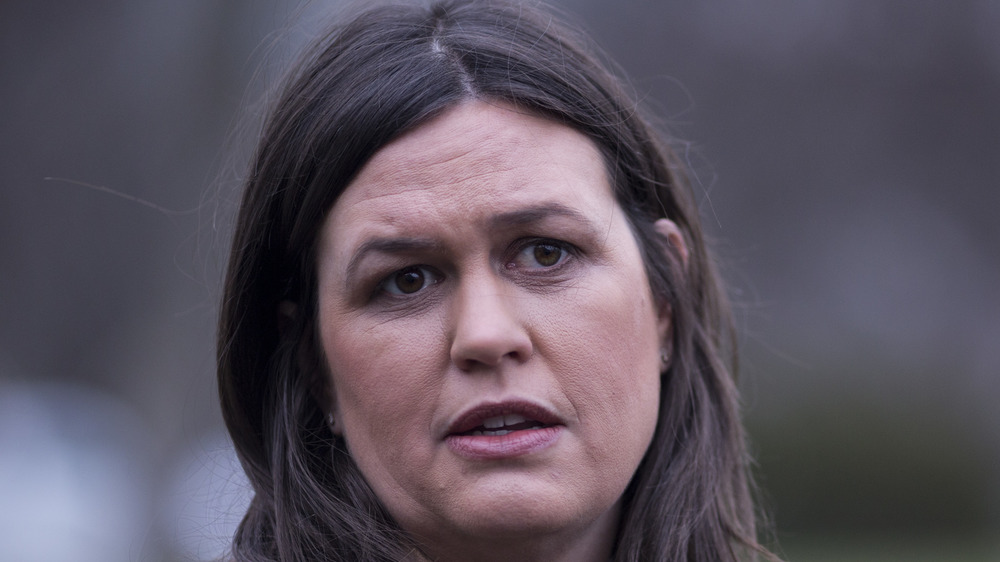 Sarah Huckabee Sanders speaking with reporters