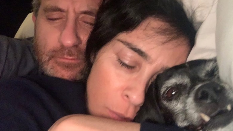 Rory Albanese, Sarah Silverman, and their dog snuggling in bed