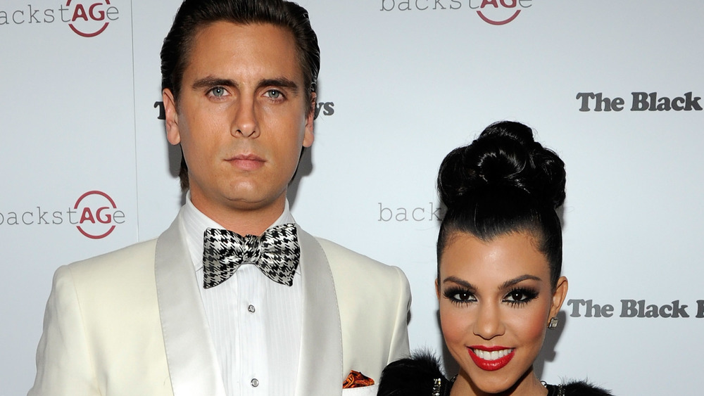 Kourtney Kardashian and Scott Disick pose