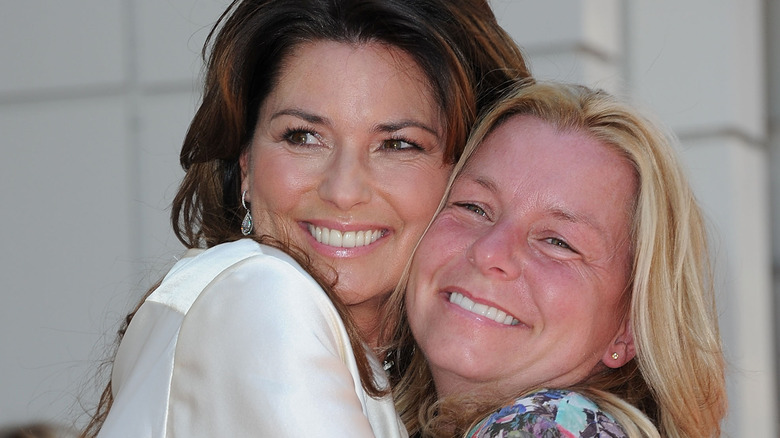 Shania Twain hugs her sister