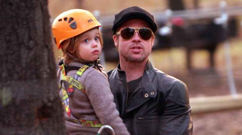 Brad Pitt holding Shiloh Jolie-Pitt