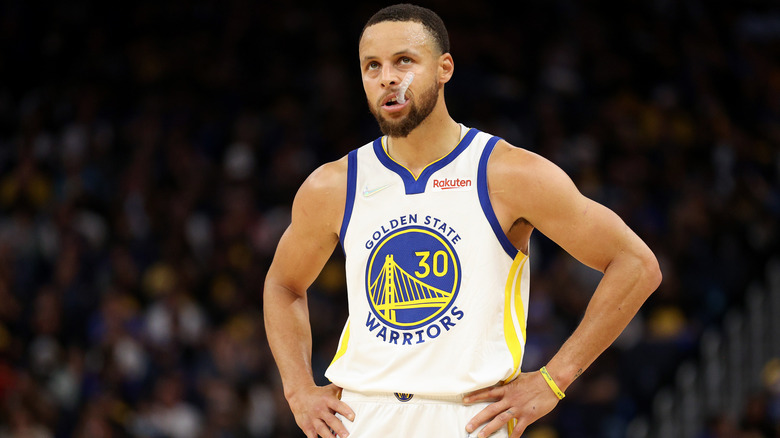 Stephen Curry standing on basketball court