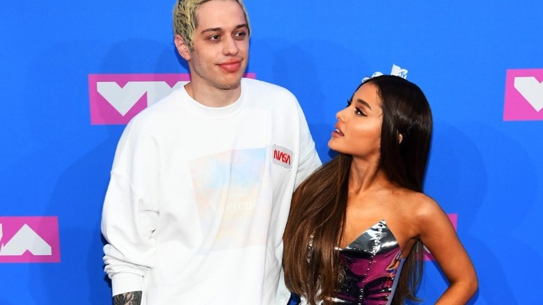 Ariana Grande posing with Pete Davidson