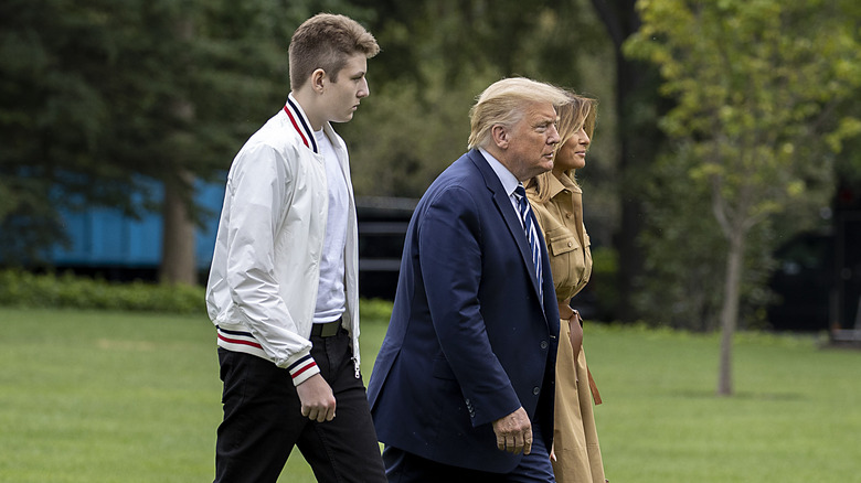 Barron Trump walking with Donald and Melania Trump