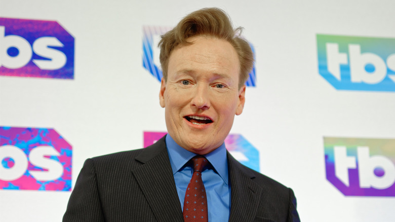 Conan O'Brien looking down