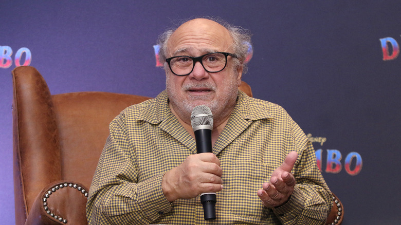 Danny Devito explaining something to the crowd