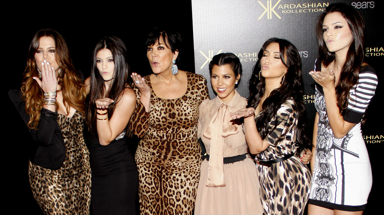 Kourtney Kardashian with her sister Kim, Khloe, Kendall, and Kylie and their mother Kris Jenner