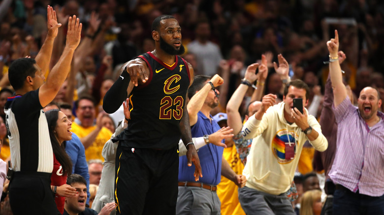 LeBron James standing near fans