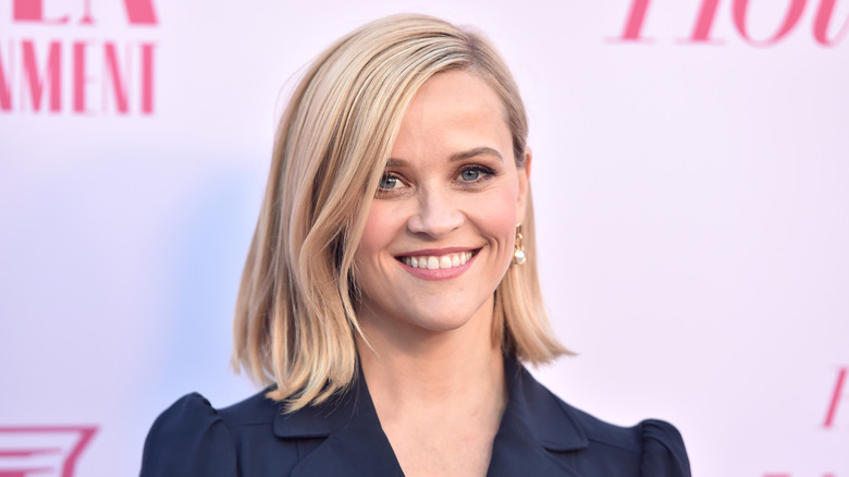 Reese Witherspoon wearing a navy blue jacket