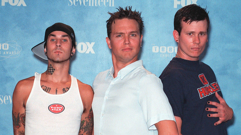 Blink 182 members posing together