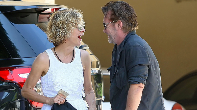 Meg Ryan and John Mellencamp laughing