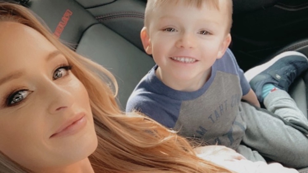 Maci Bookout smiling with son