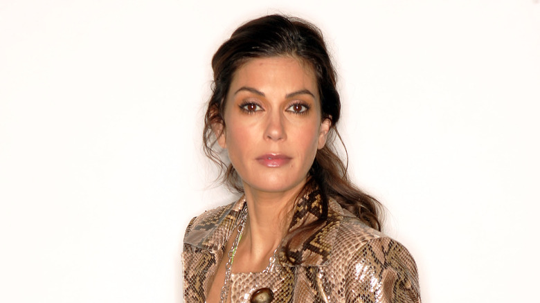 Teri Hatcher poses in a snakeskin jacket.