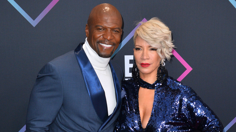 Terry and Rebecca King-Crews pose on a red carpet