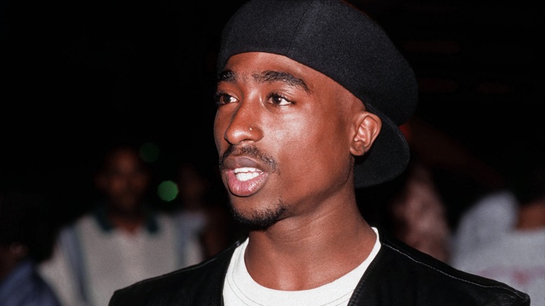 Tupac wearing a black hat