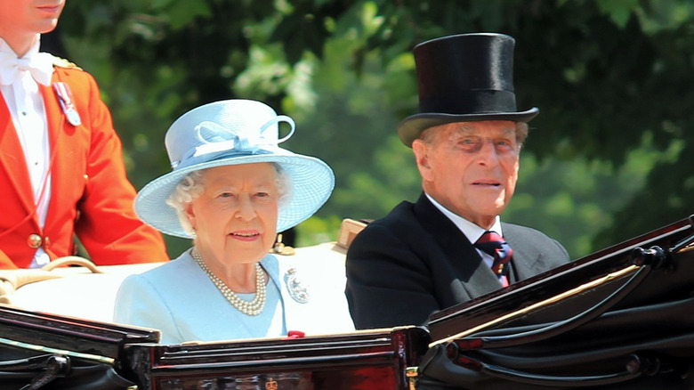 Queen Elizabeth and Prince Philip in a car